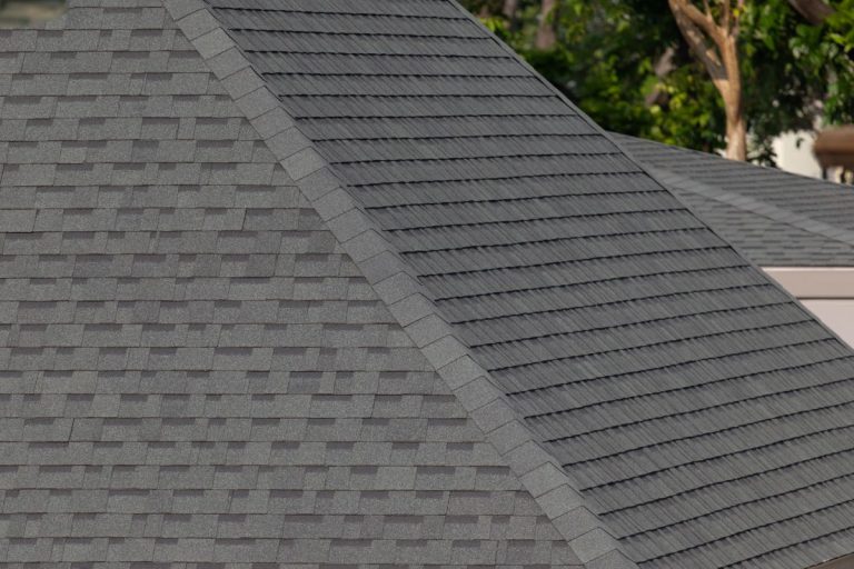 Dark gray shingles line a sloped roof with neat rows on a house in Lakeville